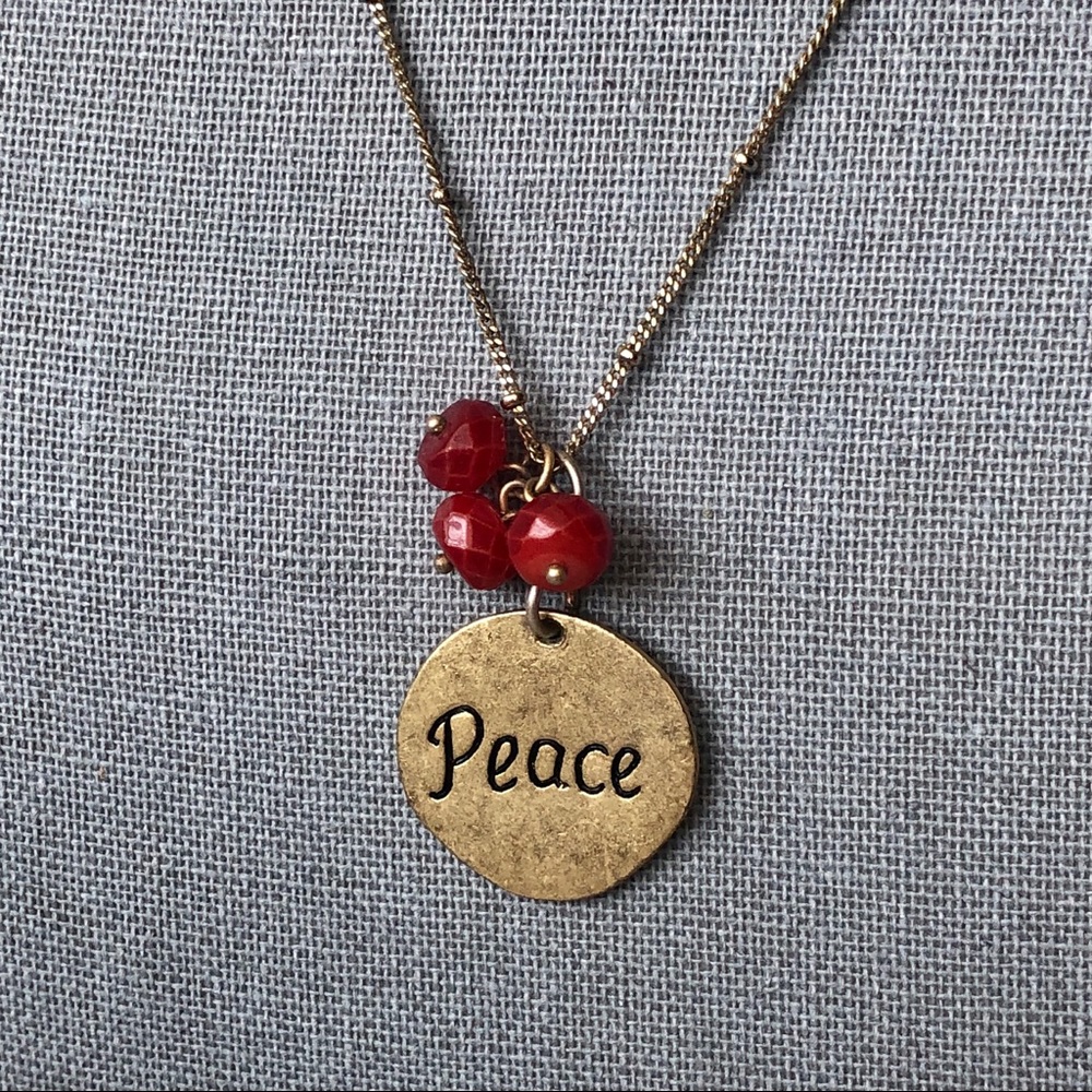 Gold “Peace” necklace with red beads